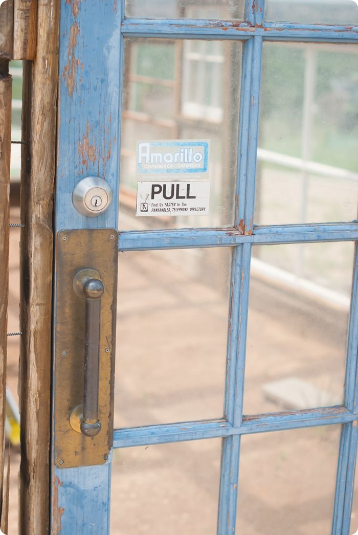 upcycled greenhouse made from reclaimed wood, vintage windows and doors