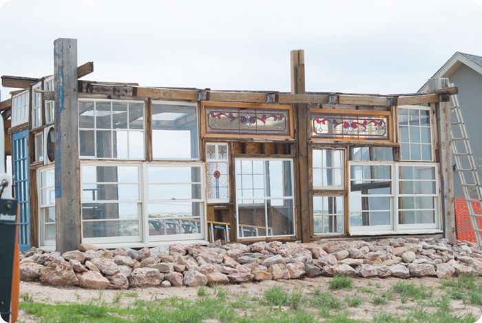 upcycled greenhouse made from reclaimed wood, vintage windows and doors