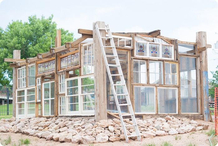 upcycled greenhouse made from reclaimed wood, vintage windows and doors