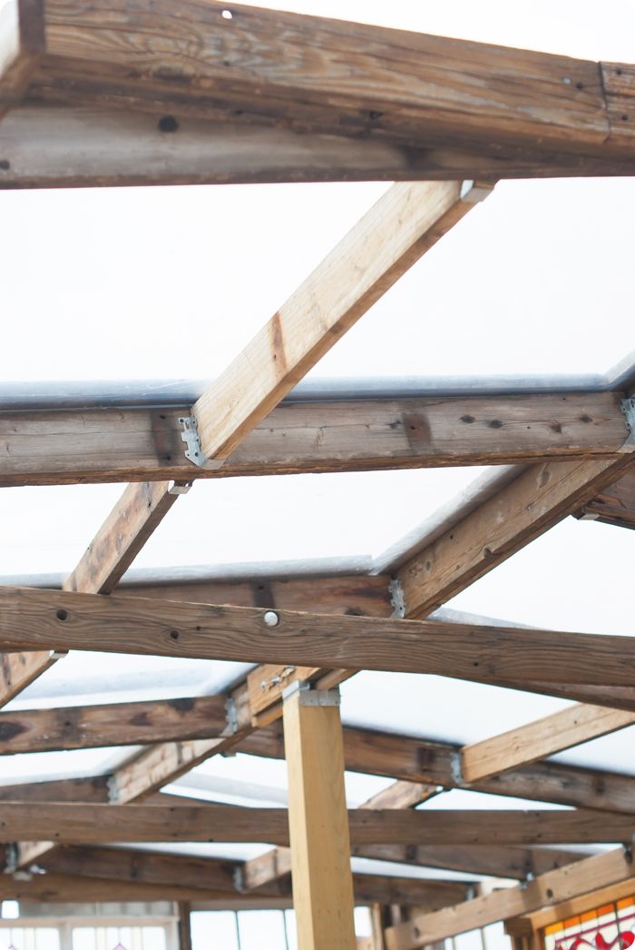 upcycled greenhouse made from reclaimed wood, vintage windows and doors