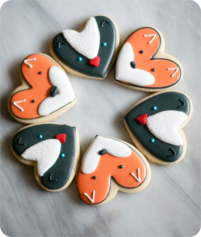 fox and skunk cookies from a heart cookie cutter, simple cookie decorating tutorials