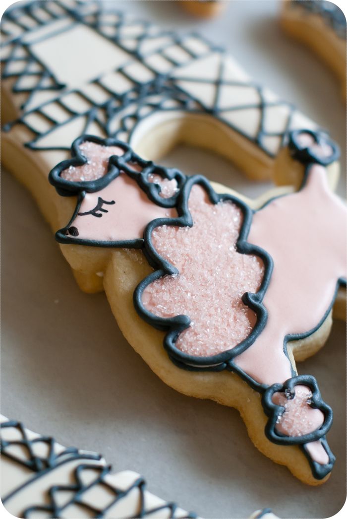 a paris-themed decorated cookie set: eiffel tower, poodles, and hearts in soft colors 