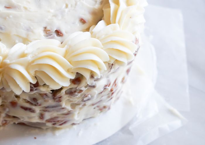 Mom's Italian Cream Cake, a rich, coconut-studded fluffy cake with decadent toasted pecan-cream cheese frosting