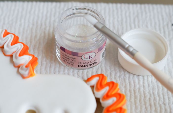 How to make UNI-candy-CORN cookies! Unicorn decorated cookies for dressed up for Halloween! | bakeat350.blogspot.com