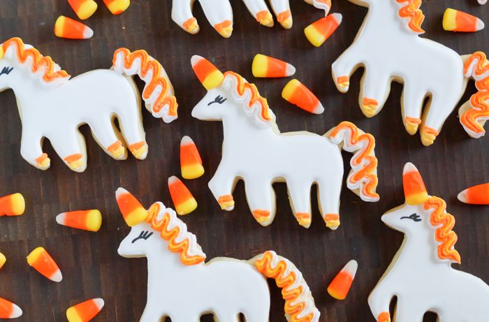 How to make UNI-candy-CORN cookies! Unicorn decorated cookies for dressed up for Halloween! | bakeat350.blogspot.com
