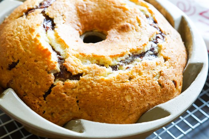 Cinnamon Roll Bundt Cake with a thick, vanilla bean-cream cheese frosting.