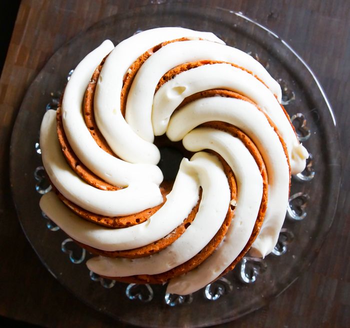 Cinnamon Roll Bundt Cake with a thick, vanilla bean-cream cheese frosting.