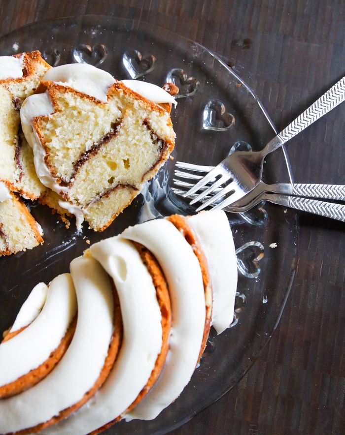 Cinnamon Roll Bundt Cake with a thick, vanilla bean-cream cheese frosting. | bakeat350.blogspot.com