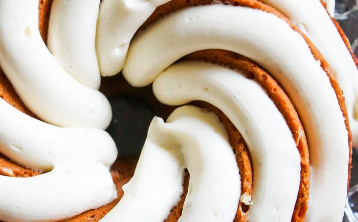 Cinnamon Roll Bundt Cake with a thick, vanilla bean-cream cheese frosting.