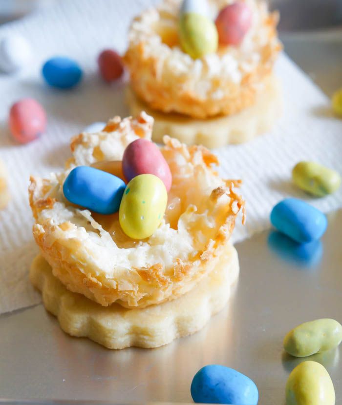 Lemon Coconut Bird's Nest Cookies...a coconut macaroon nest atop a buttery lemon cookie with lemon curd and chocolate eggs.